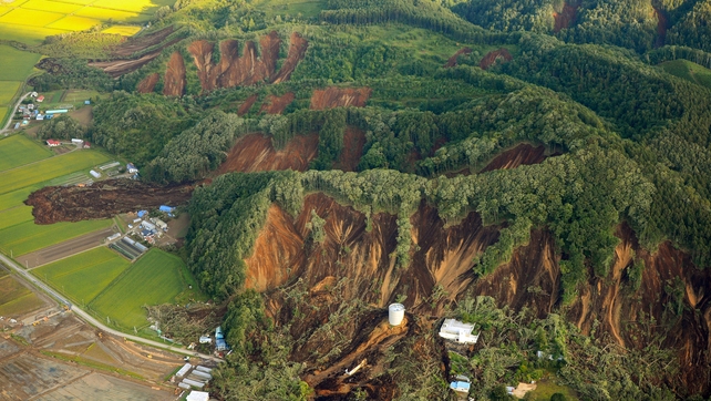 Aerial pictures show landslides exposing barren hillsides in southern Hokkaido