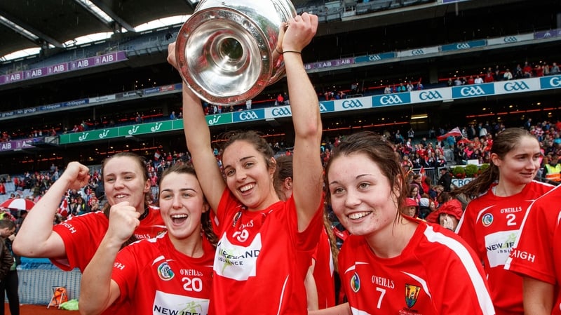 Julia White hoists the trophy afer last year's final