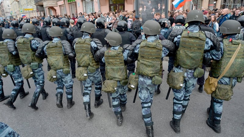 Russian police block a street during a protest rally in Saint Petersburg today