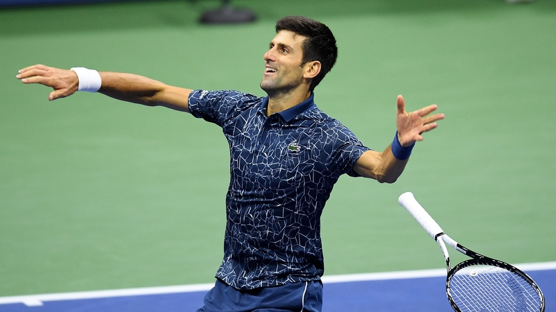 Novak Djokovic drops his racquet after winning match point