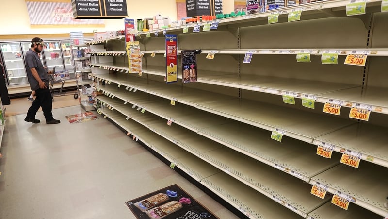Bread shelves in a shop are bare as people stock up on food ahead of the arrival of Hurricane Florence in Myrtle Beach, South Carolina