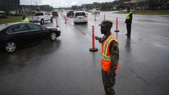 The South Carolina National Guard directs traffic as the South Carolina government ordered that traffic use all lanes leading away from the coast to facilitate the evacuation