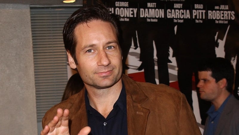 Duchovny; he believes . . . in rock `n' roll