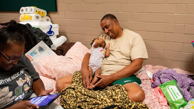 Avair Vereen, her fiance and their baby take shelter at a school in Conway South Carolina