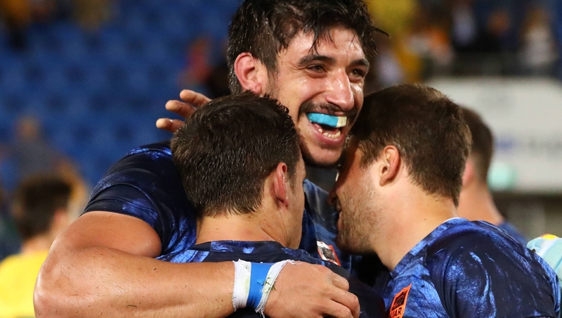 Argentina's Javier Ortega Desio embraces Bautista Ezcurra (L) and Ramiro Moyano (R)