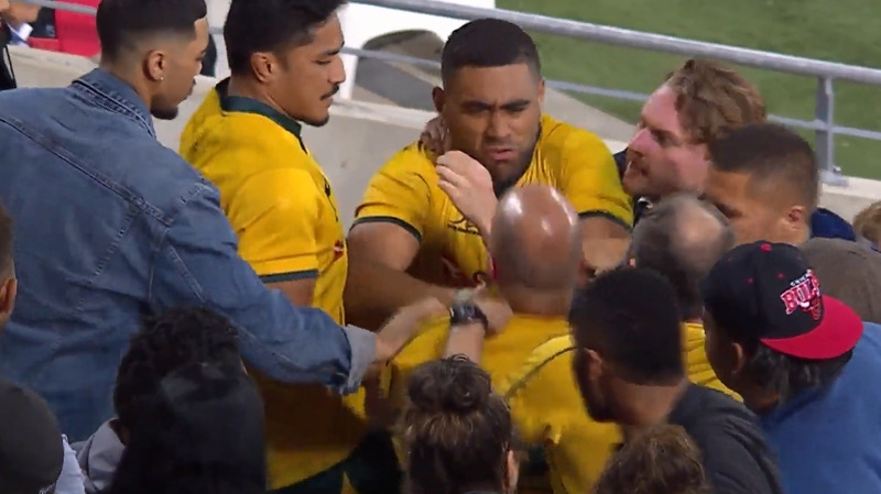 Wallaby flanker Lukhan Tui tussles with a fan in the stands after Australia's loss to Argentina in the Gold Coast