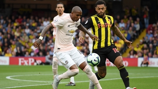 Ashley Young holds off Andre Gray