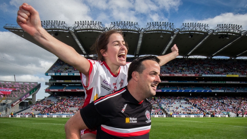 A jubilant Aine Canavan is carried by Damien Corrigan after Tyrone's win