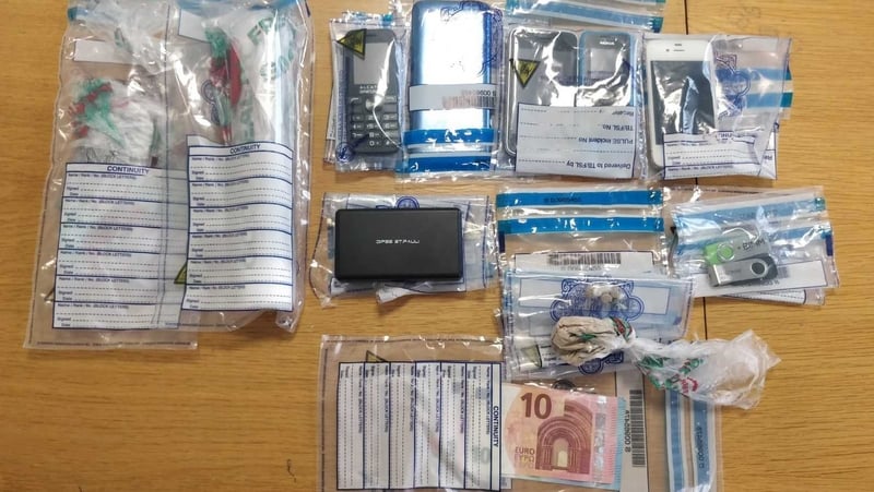 Cash, drugs, documents for international bank transfers and phones were seized during the raids