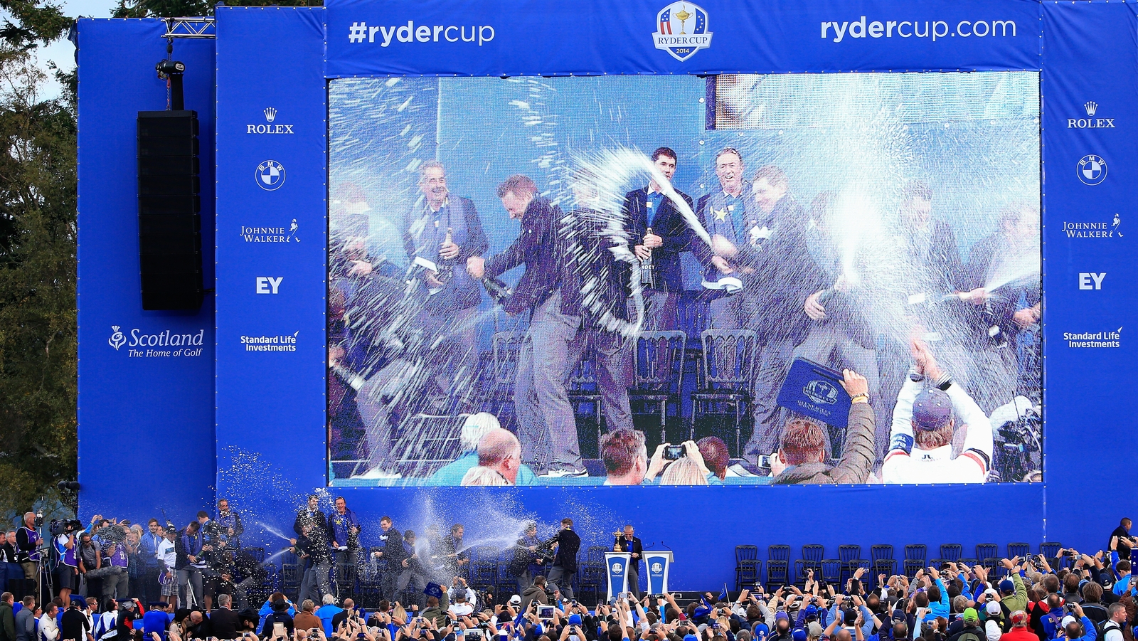 Paul McGinley drenched in champagne following his successful 2014 captaincy