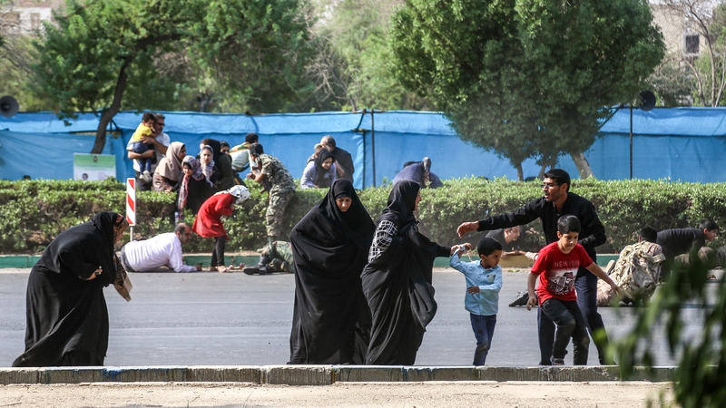People flee the scene of the attack in Ahvaz