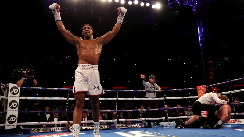 Anthony Joshua celebrates following a tough defence of his heavyweight title