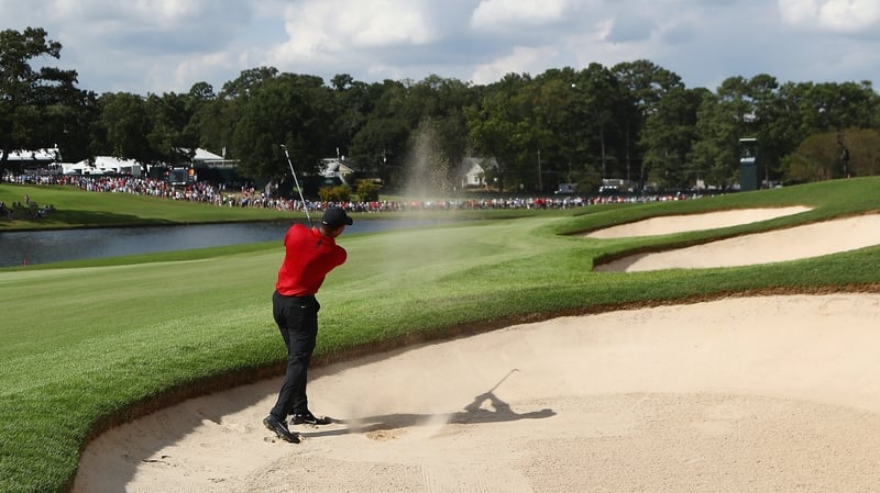 Woods famously wears a red shirt and black trousers on Sundays