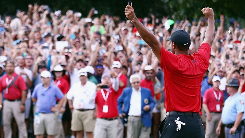Tiger Woods salutes the crowd after clinching the Tour Championship title