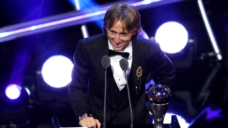 Croatia and Real Madrid midfielder Luka Modric accepts his award at the gala event in London