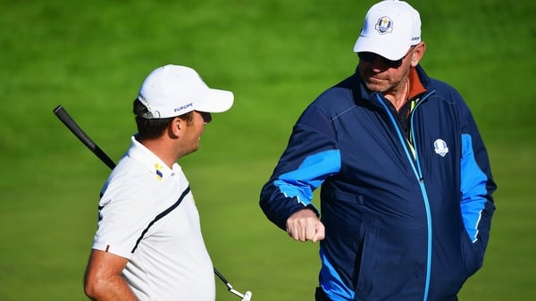 European captain Thomas Bjorn speaks with Francesco Molinari