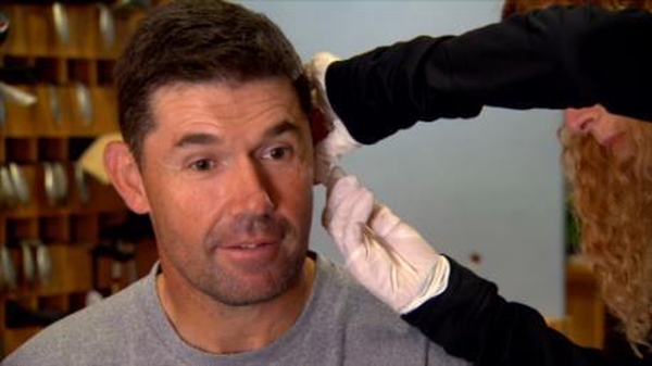 A sample of blood is taken from Padraig Harrington's earlobe