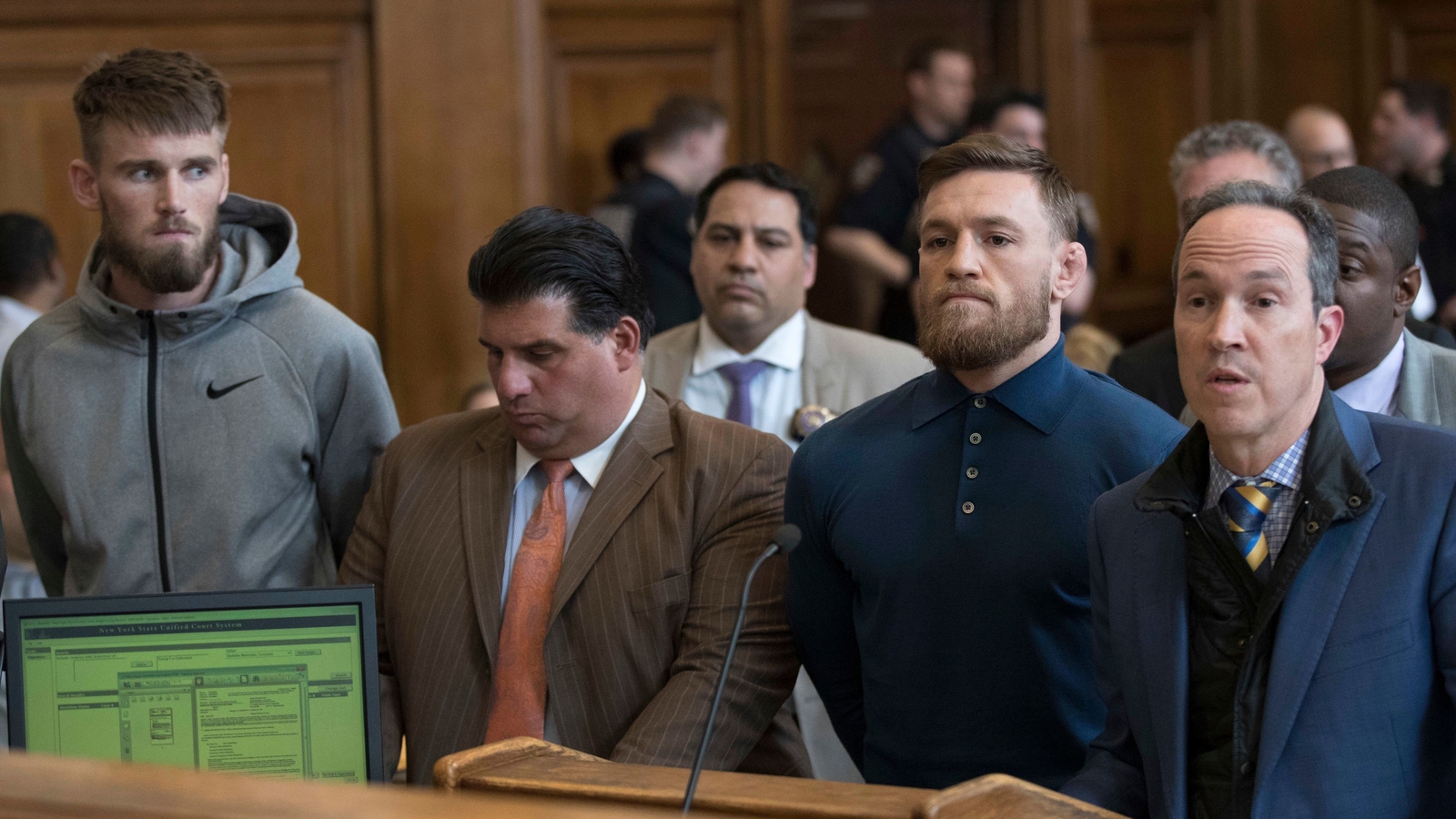 McGregor next to his lawyer Jim Walden (R) in Brooklyn Criminal Court in April