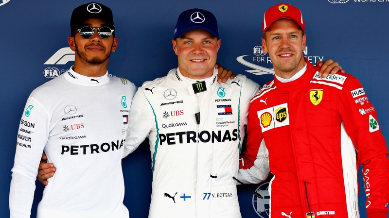 Valtteri Bottas of Finland and Mercedes GP (C), Lewis Hamilton of Great Britain and Mercedes GP (L) and Sebastian Vettel of Germany and Ferrari