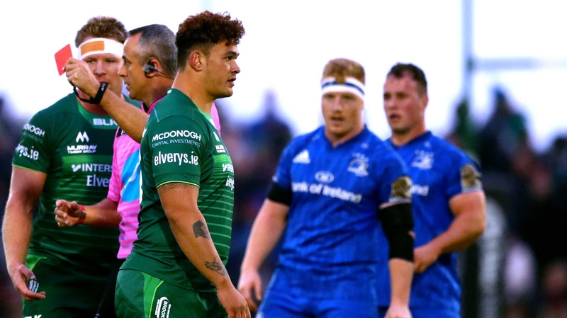 Dominic Robertson-McCoy walks after receiving a red card