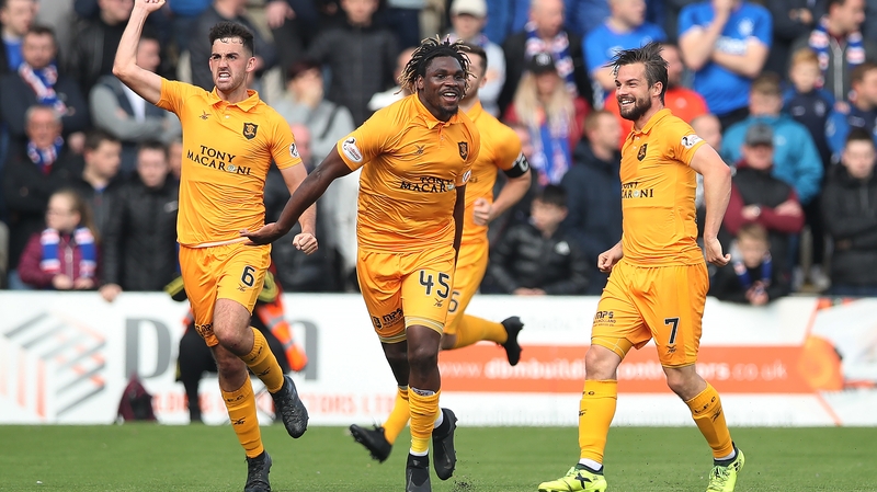 Dolly Menga of Livingston celebrates his goal