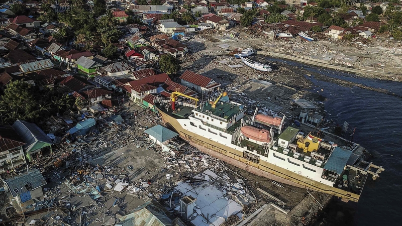 A ship stranded on the shore after the tsunami hit an area in Donggala