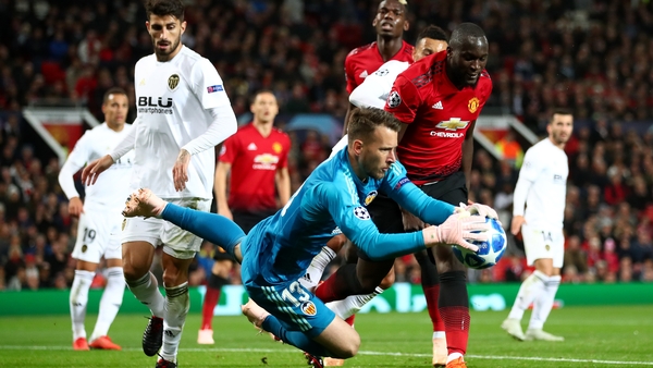 Valencia goalkeeper Neto makes a save under pressure from Romelu Lukaku