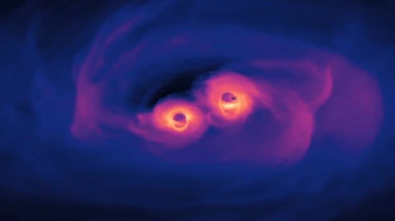 The new simulation shows three orbits of a pair of supermassive black holes only 40 orbits from merging