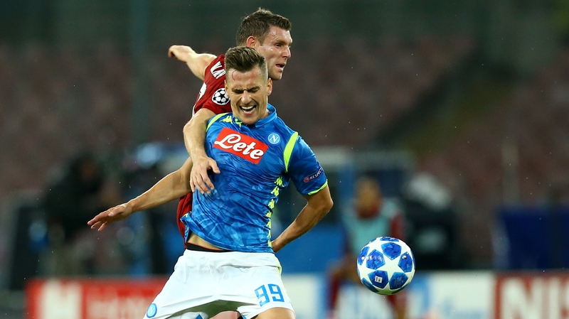 Arkadiusz Milik holds off Liverpool's James Milner