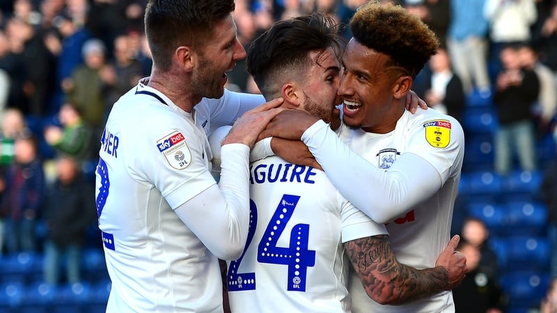 Sean Maguire celebrates with Callum Robinson