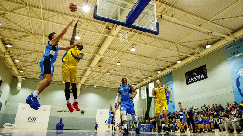 CandS Neptune's Roy Downey with Michael Bonaparte of DCU Saints