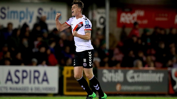 Ian Morris celebrates his long-range strike at Turner's Cross