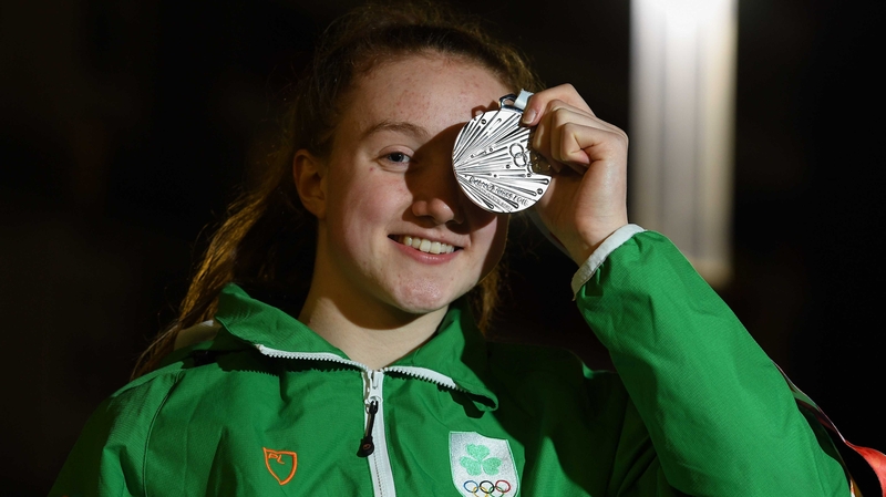 Niamh Coyne gets a good look at her silver medal.
