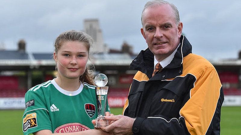 Éabha O'Mahony of Cork City is presented with the Player of the Month award for August by Tom Dennigan of Continental Tyres Group