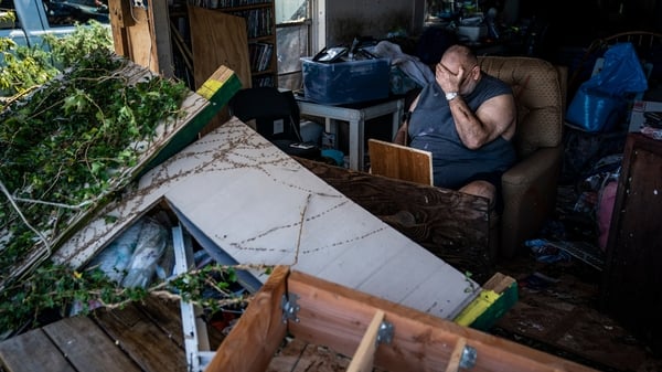 Benny Hobson, 69, sits in what is left of his home in Panama City, Florida