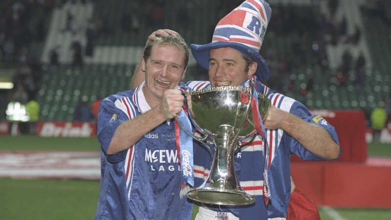 Paul Gascoigne (left) and teammate Ally McCoist pose with the Scottish Coca Cola Cup trophy in 1996