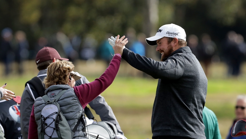 Lowry congratulated by spectator after his hole in one on the 5th hole