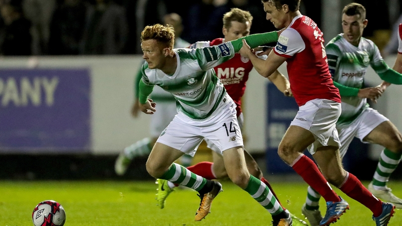 Gary Shaw and Michael Leahy tussle for the ball