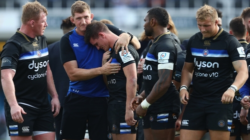 Burns consoled by Stuart Hooper at the final whistle