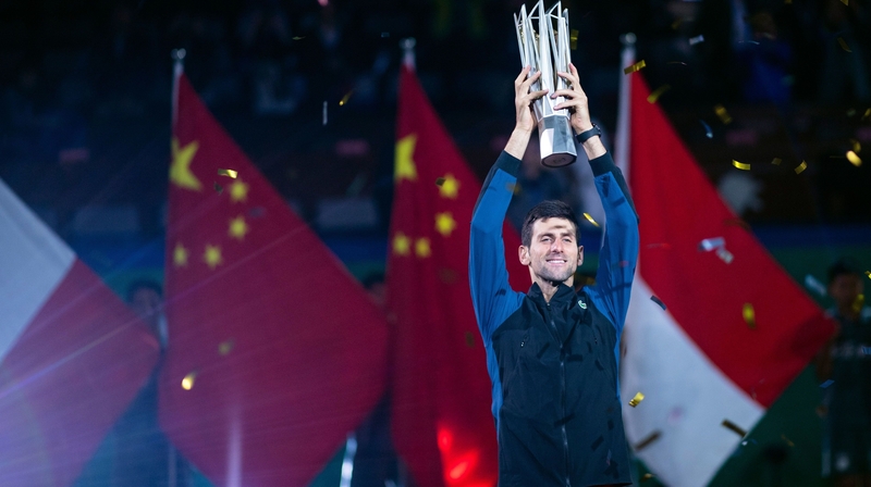 Novak Djokovic poses with his trophy after beating Borna Coric