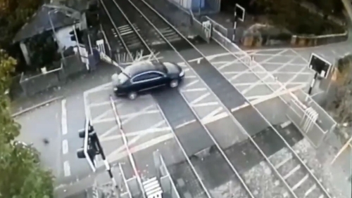 CCTV footage shows the car crashing through the crossing at Porterstown