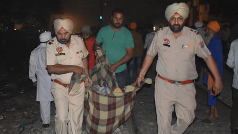 Another train had narrowly missed the crowds two minutes earlier, officials said