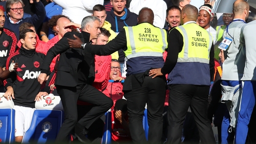 Stewards held back Jose Mourinho after Chelsea assistant coach Marco Ianni celebrated exuberantly in front of him