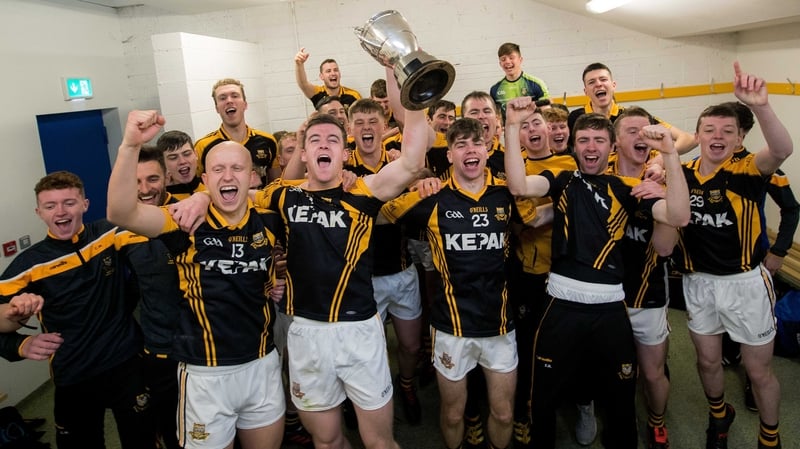 Ballyea players celebrate with the cup