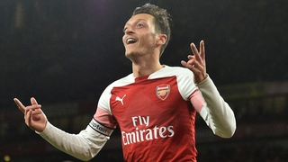 Mesut Ozil wheels away in cerebration after equalising for Arsenal