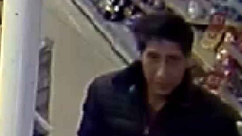 The suspect was pictured leaving a restaurant in Blackpool carrying what appeared to be a crate of cans (Pic: Blackpool Police facebook)