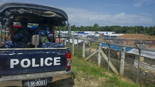 Myanmar police patrol a Rohingya camp on the border with Bangladesh