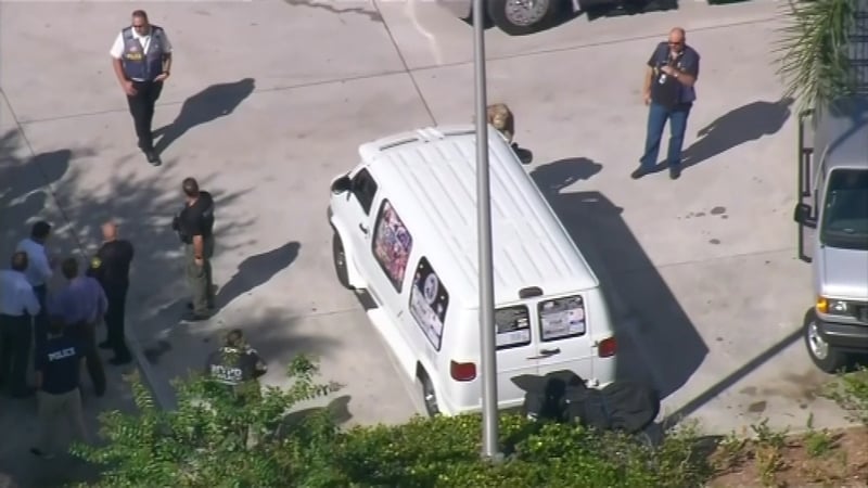 The man was arrested and investigators were seen covering his white van