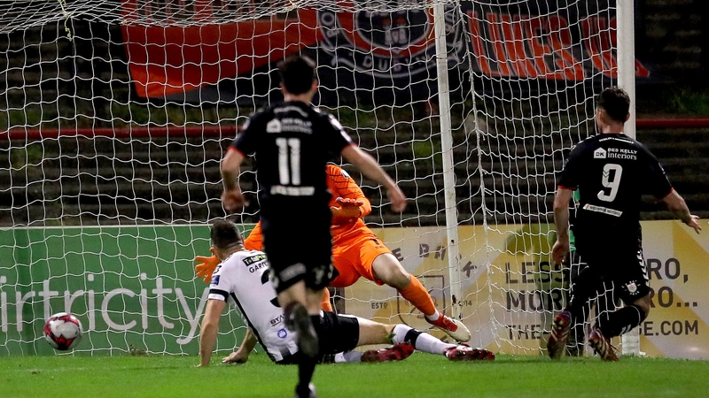 Dinny Corcoran opens the scoring at Dalymount Park