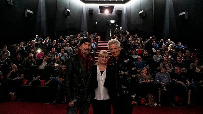 The Edge and Adam Clayton with Savoy Cinema's Sandra O'Donoghue